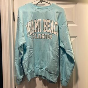 Miami Beach light blue crewneck.